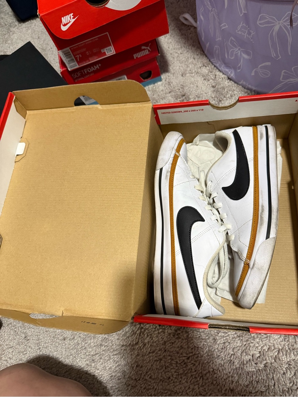 Nike White Low-Top Sneakers with Black Swoosh and Brown Trim